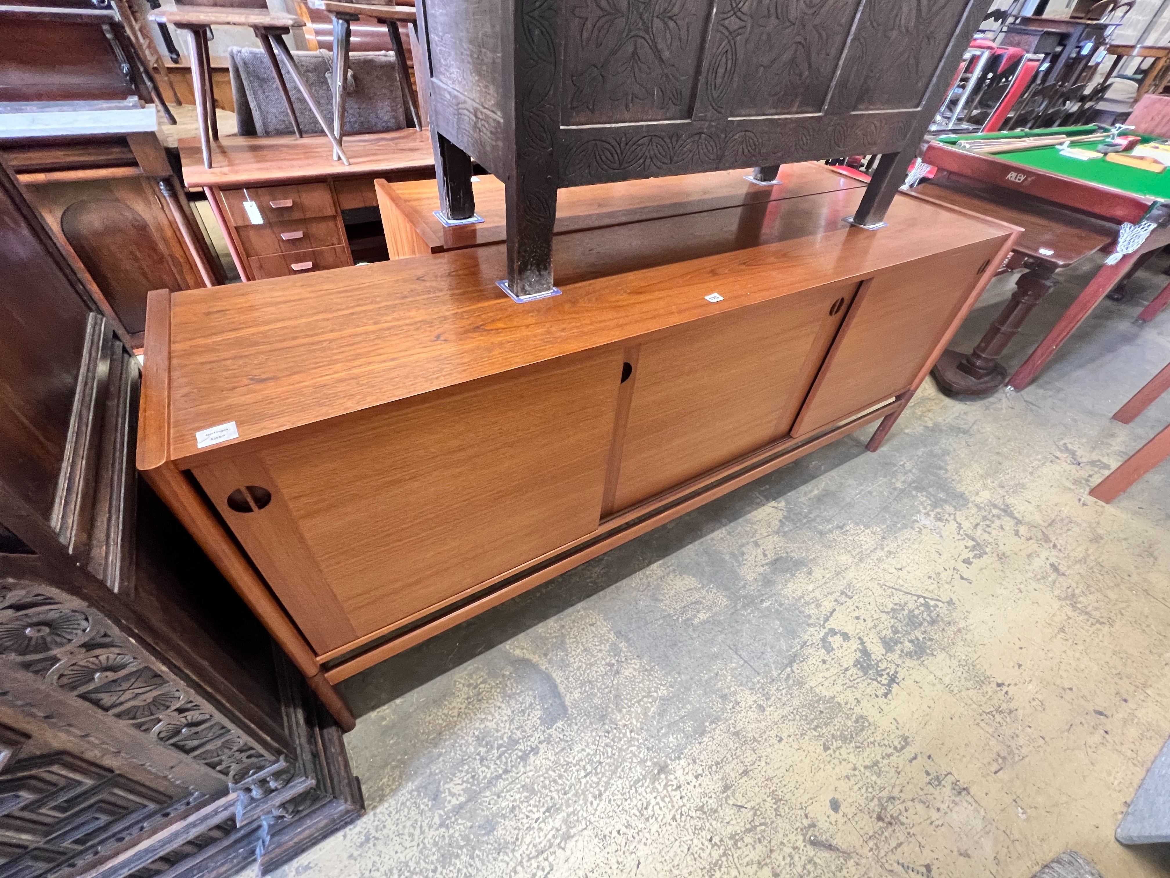 A 1950's Danish teak tambour sideboard, width 200cm depth 46cm height 86cm